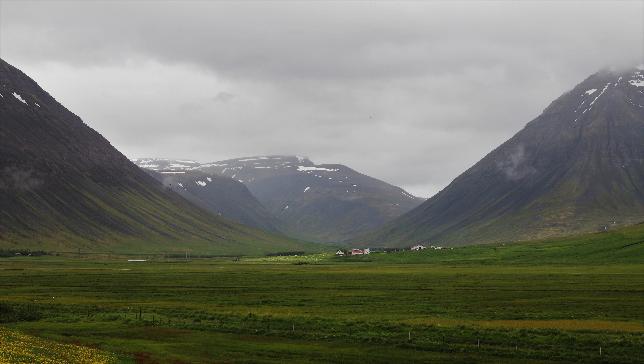 Image of mountains and fields in Iceland with overcast sky