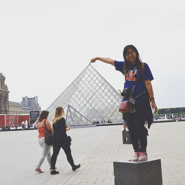 UTA student in front of the Louvre